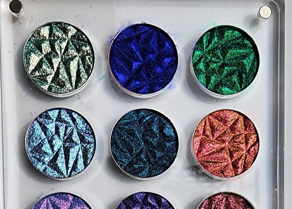 Cat-eye effect nail shades photographed in natural sunlight